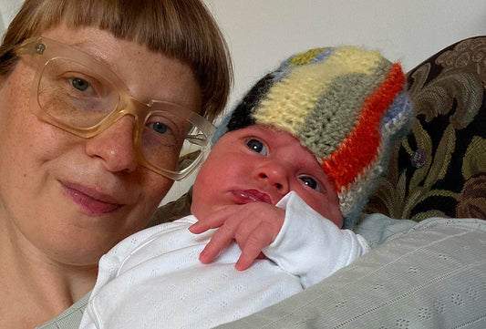 A mother holding her newborn