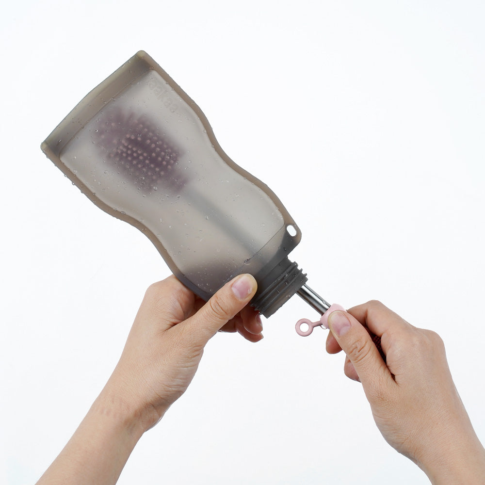 Straw brush cleaning inside silicone milk storage bag with flexible bristles