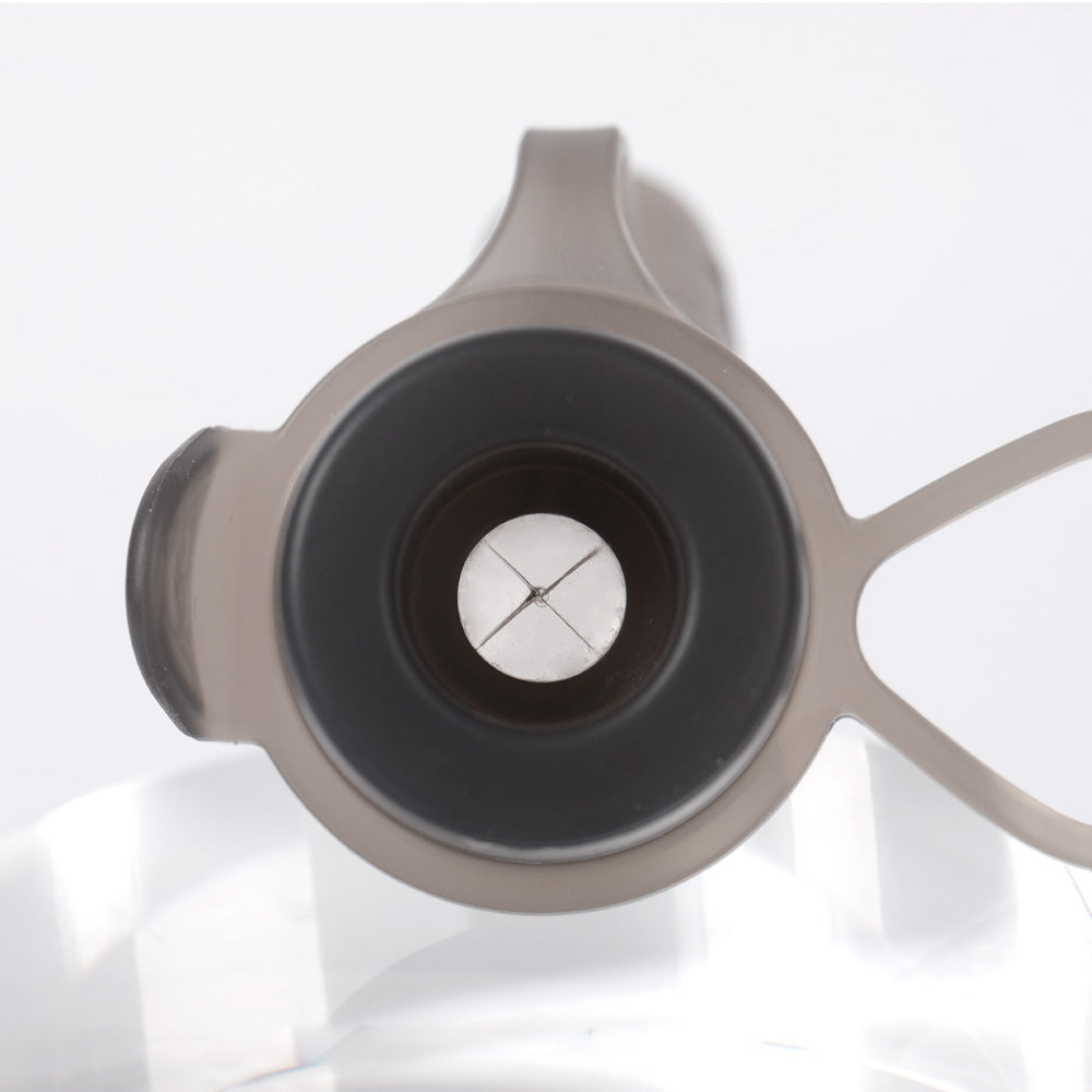 Close-up of X-cut variable flow valve on baby food pouch allowing self-paced feeding