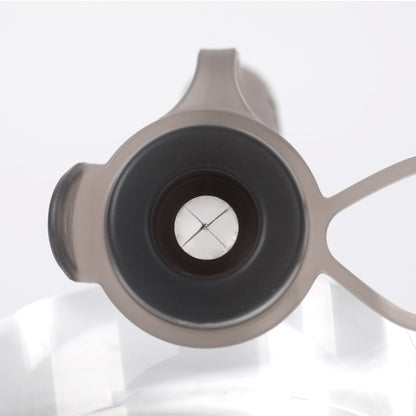 Close-up of X-cut variable flow valve on baby food pouch allowing self-paced feeding