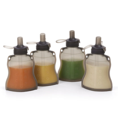 Four reusable silicone pouches filled with different colored purees showing versatile use