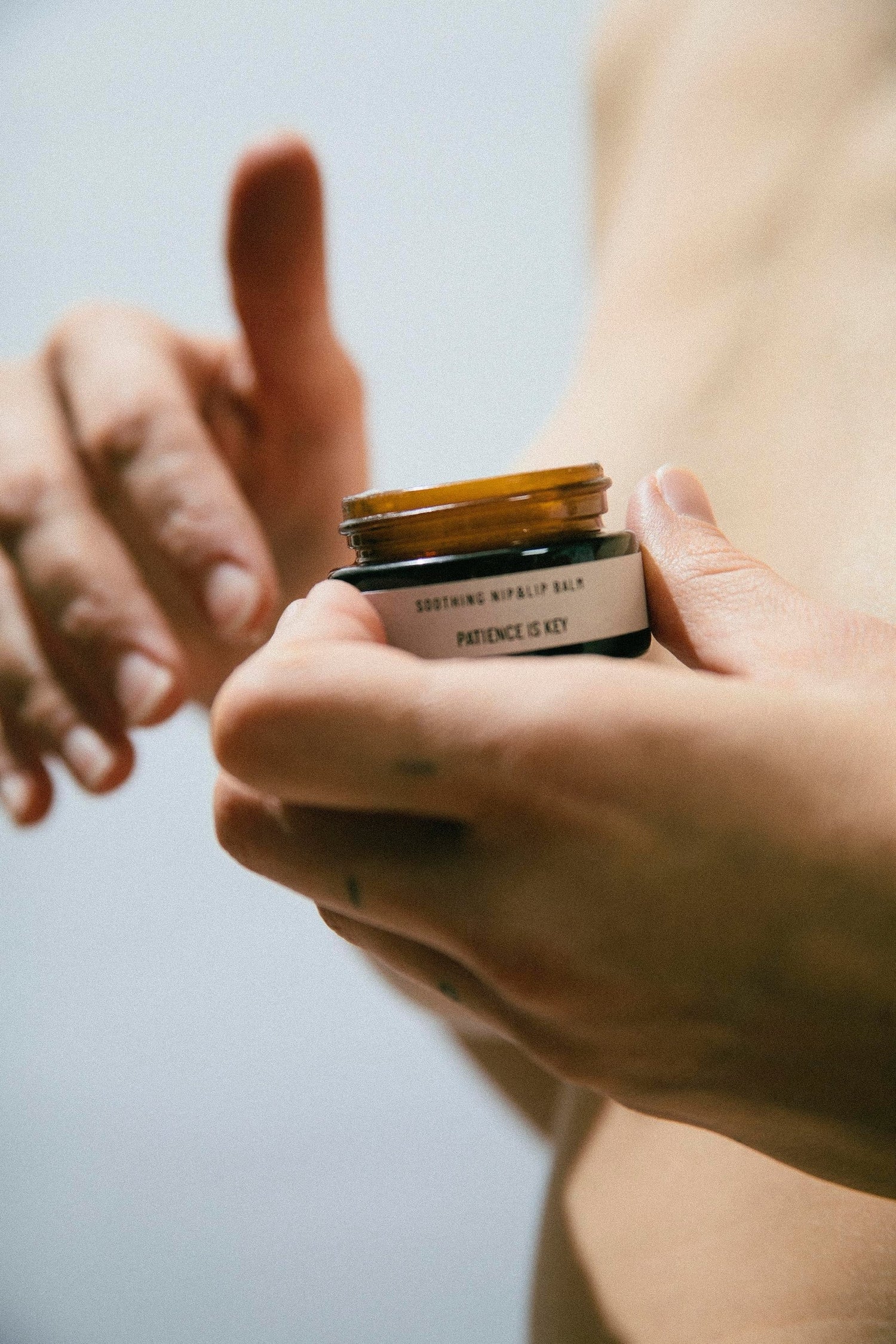 Organic nipple and lip balm showing rich texture for healing